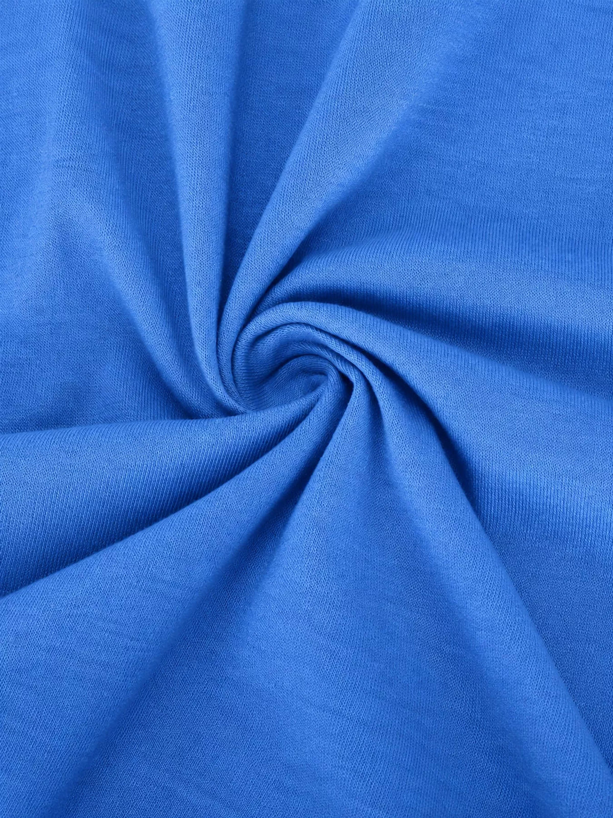 Blue textured fabric close-up with soft, gathered folds