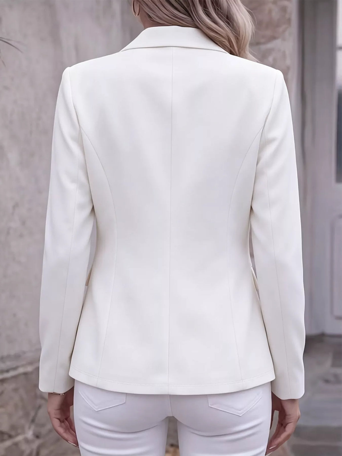 Back view of white lapel-collar long-sleeve blazer jacket with smooth seam lines