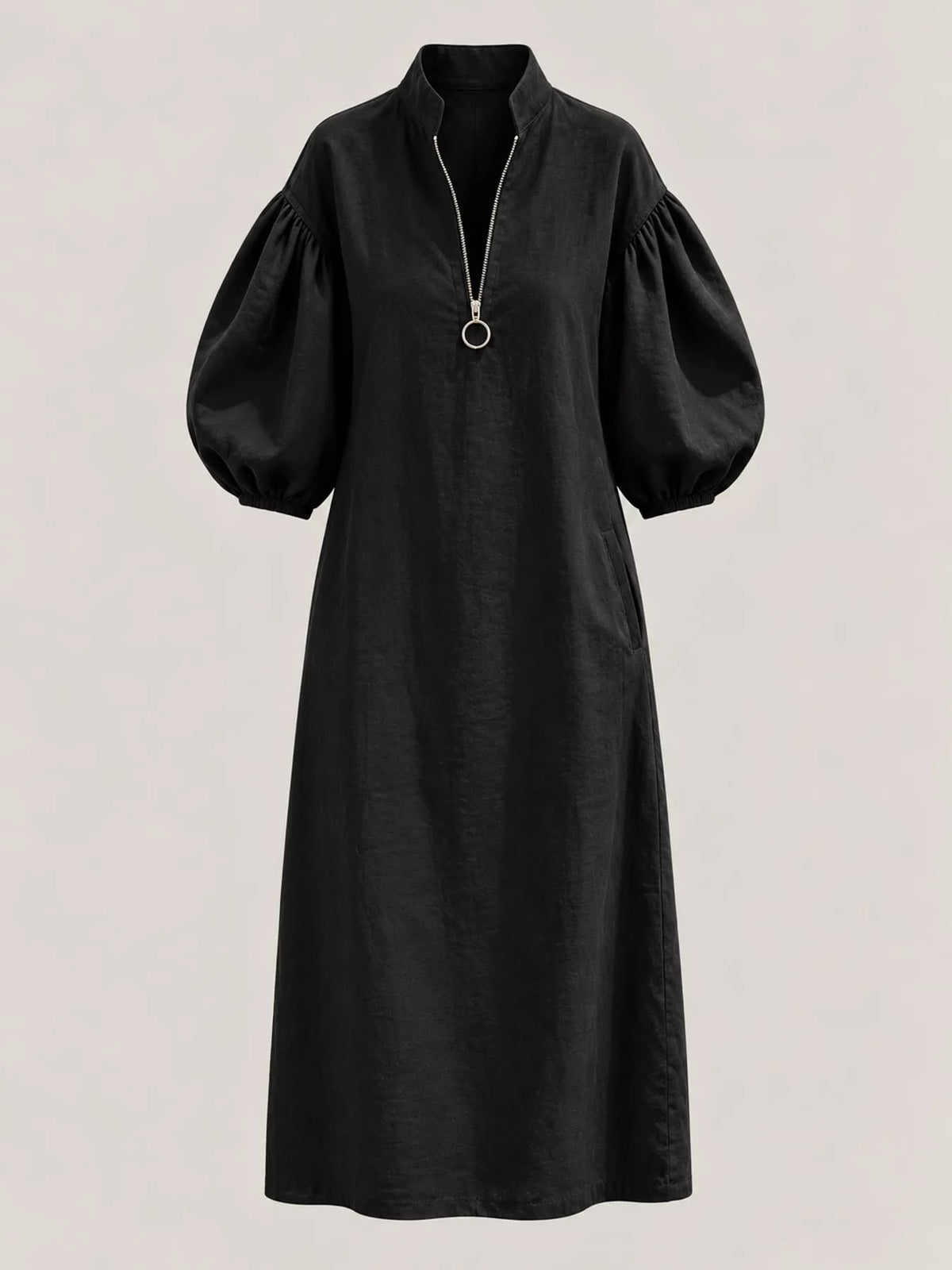 Black midi dress front view with half-zip closure and voluminous puff sleeves