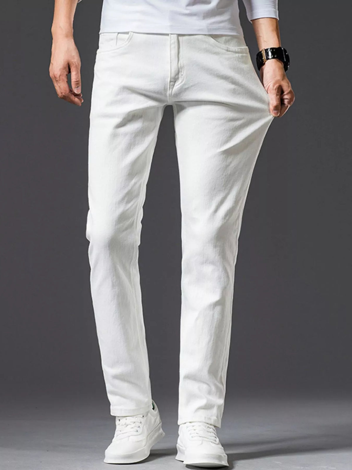 White slim-fit stretch cotton jeans with zip fly, belt loops, and five-pocket design