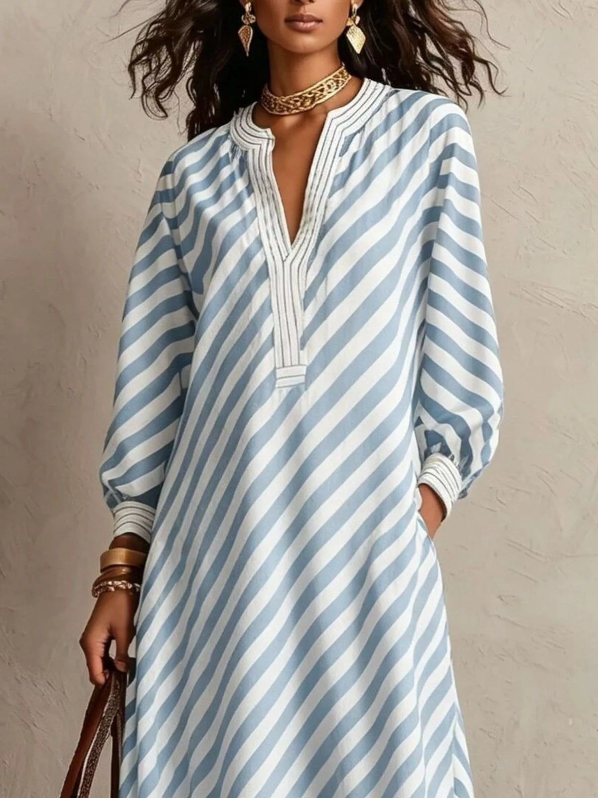 Light blue striped long-sleeve maxi dress with V-neck and gathered cuffs