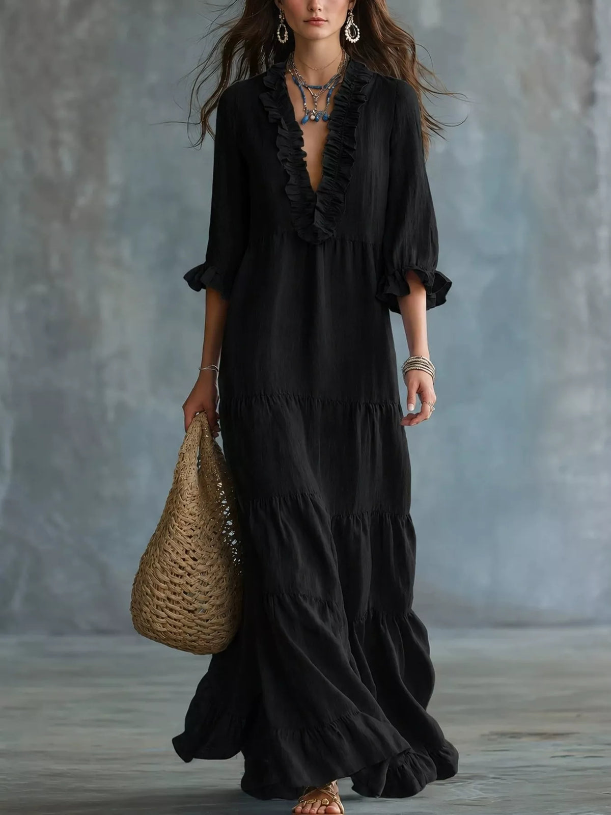 Black ruffled V-neck tiered maxi dress with three-quarter sleeves