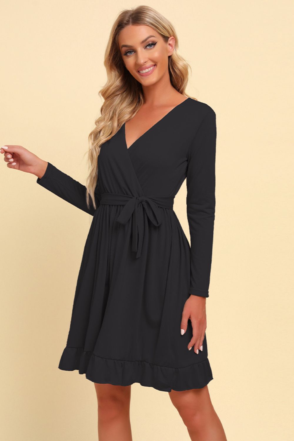 Long sleeve tie-waist ruffle hem dress, black front view with V-neck and long sleeves