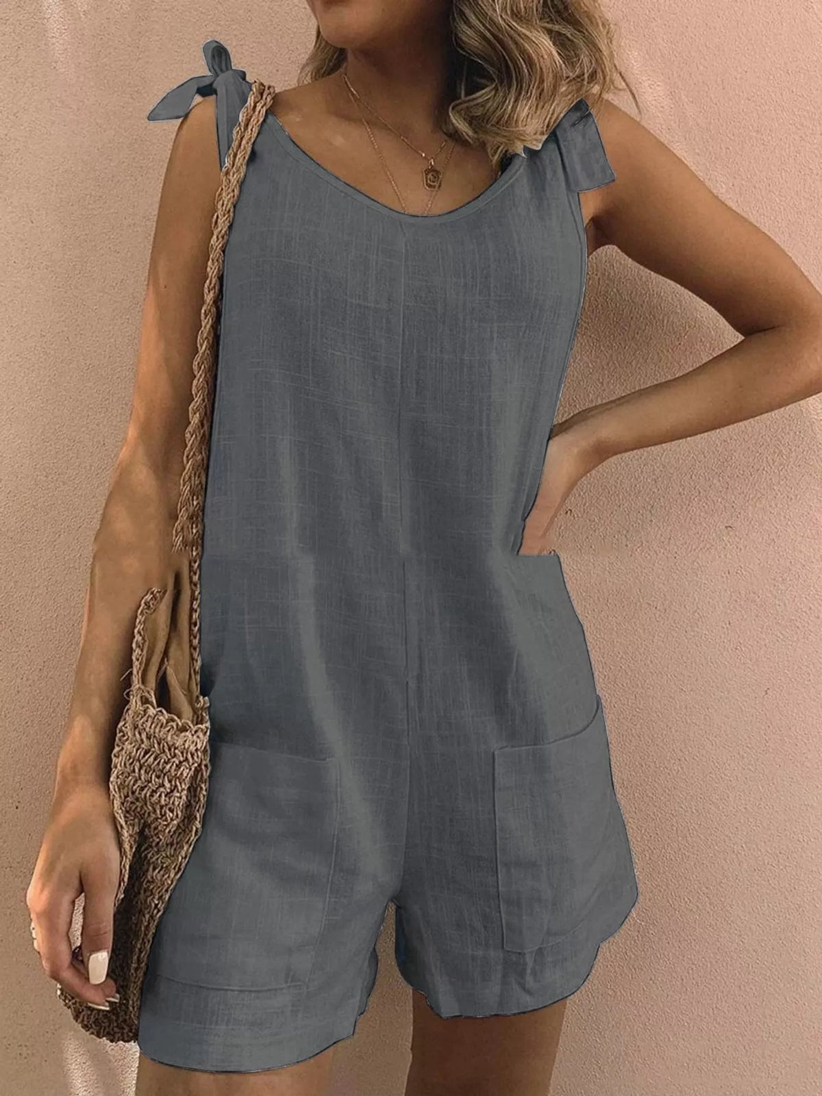 Slate blue tie-shoulder bow romper with pockets, sleeveless, mid-waist