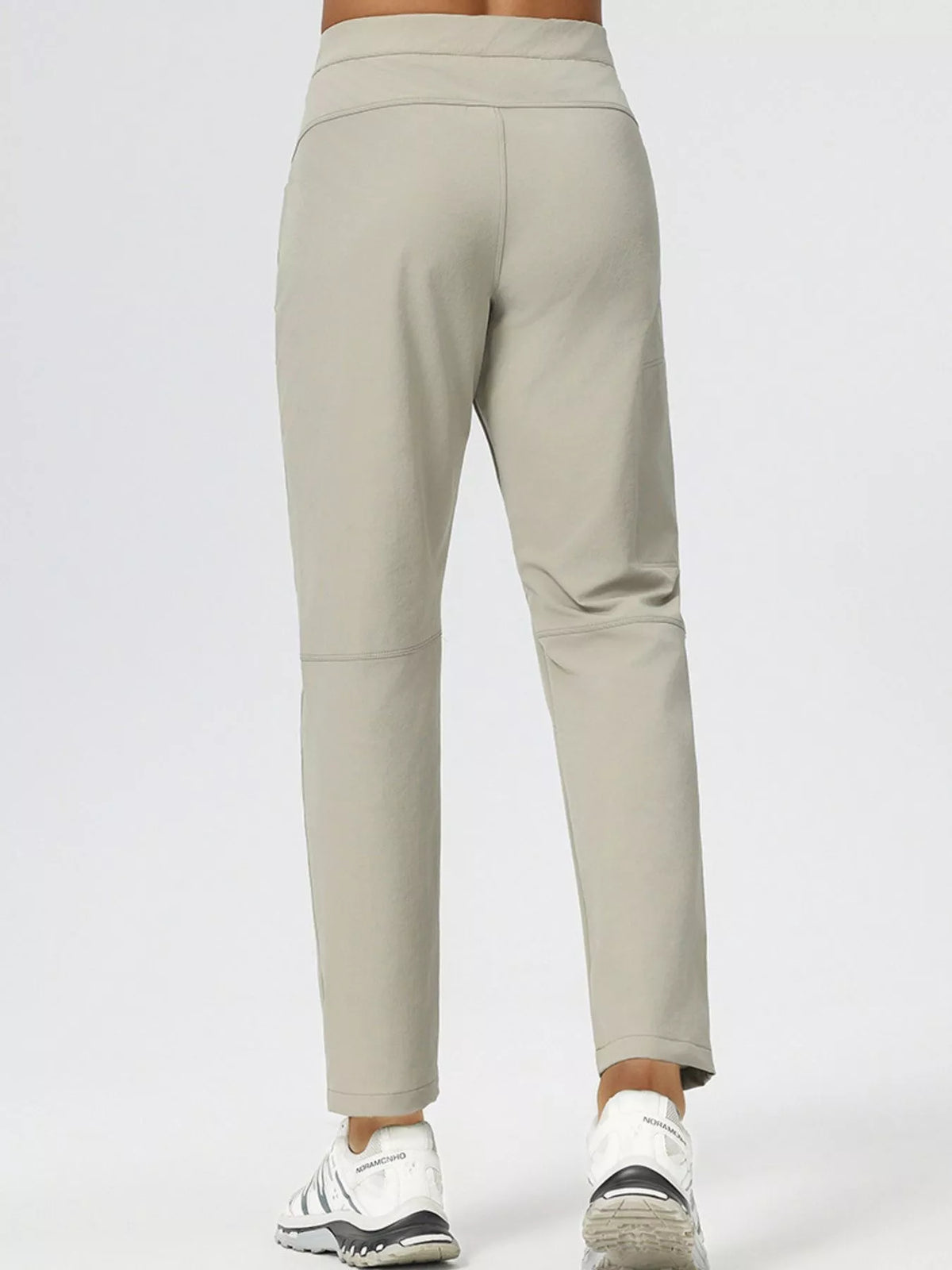 Men's slim fit stretch casual pants, light khaki, back view with waistband and pockets