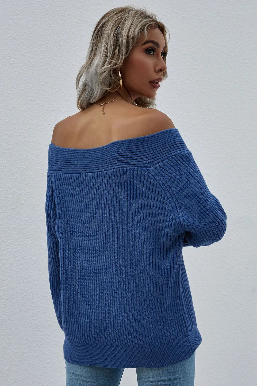 Dark blue off-shoulder rib-knit sweater, back view with long sleeves.
