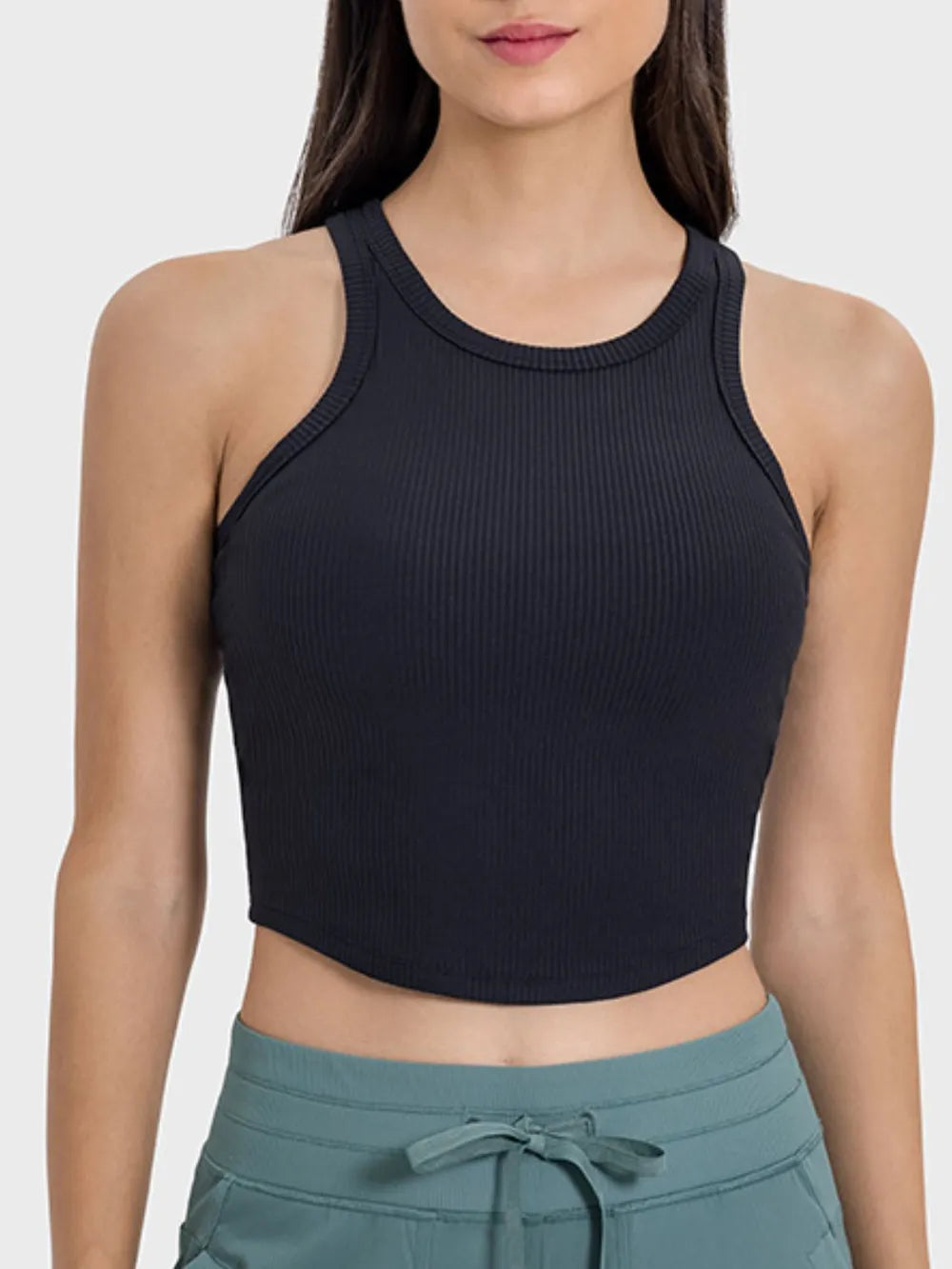 Black ribbed active tank with round neckline and racerback straps, cropped hem
