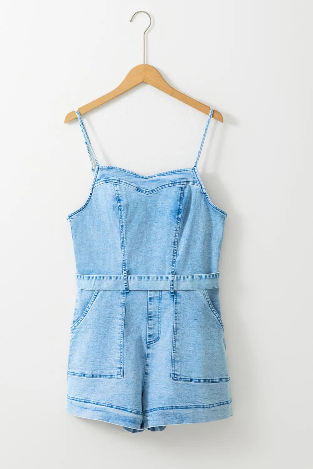 Cedar & Moore Tied Spaghetti Strap Denim Romper, light-wash denim with front pockets and belted waist