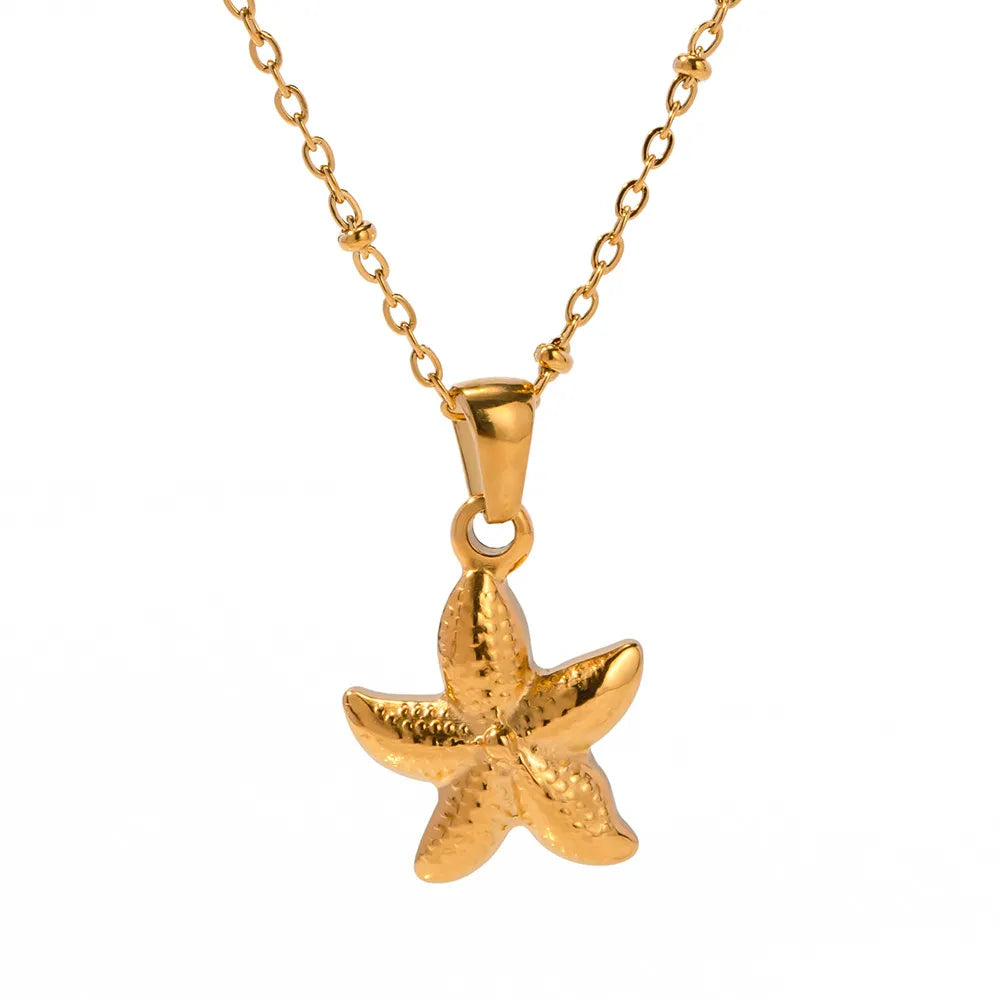 Gold-plated starfish pendant necklace with detailed starfish charm on a gold chain