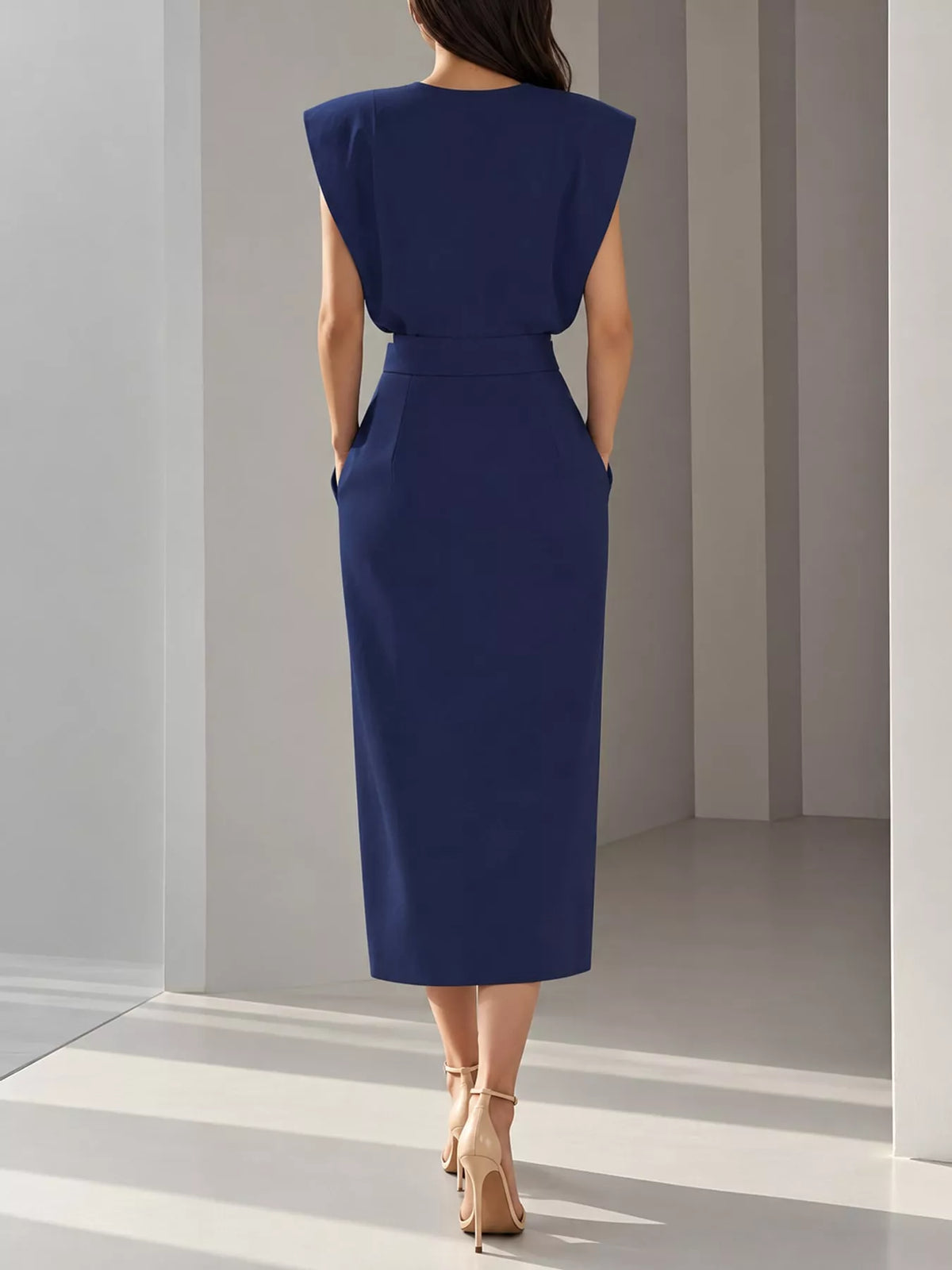 Navy sleeveless midi dress with waist belt and gold buttons, side slit
