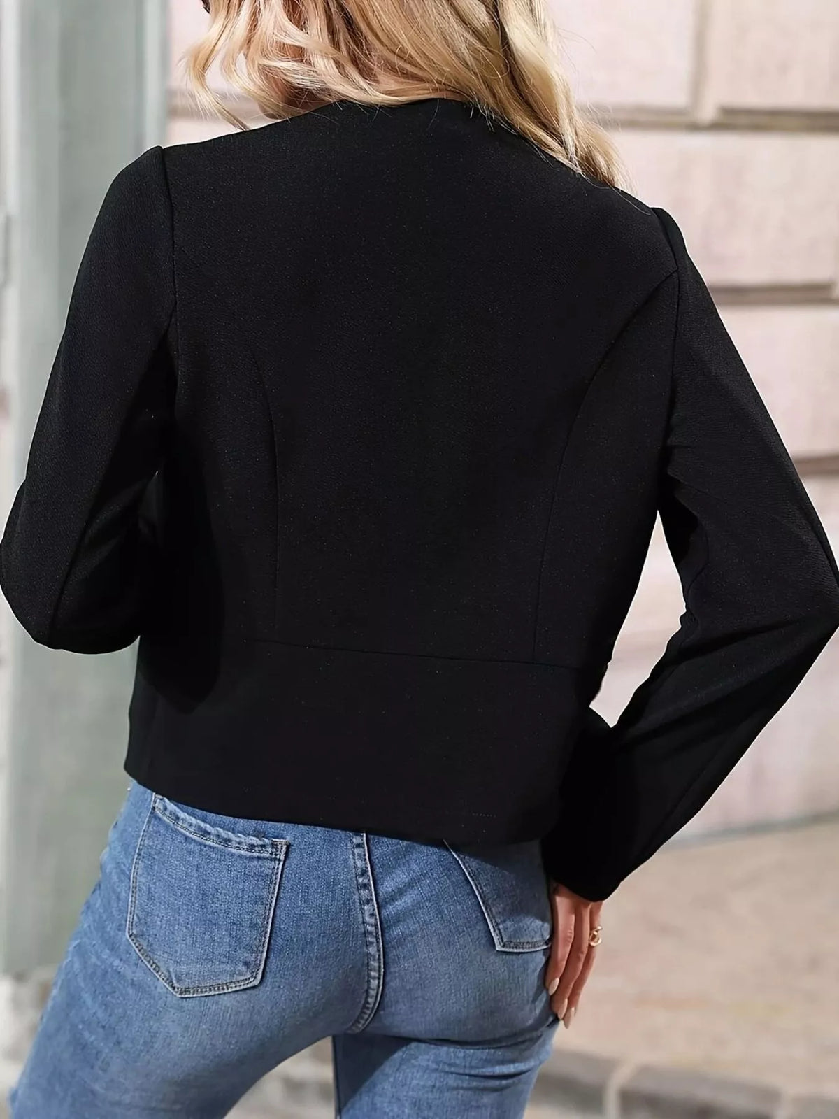 Black cropped blazer back view with long sleeves and minimal seam lines