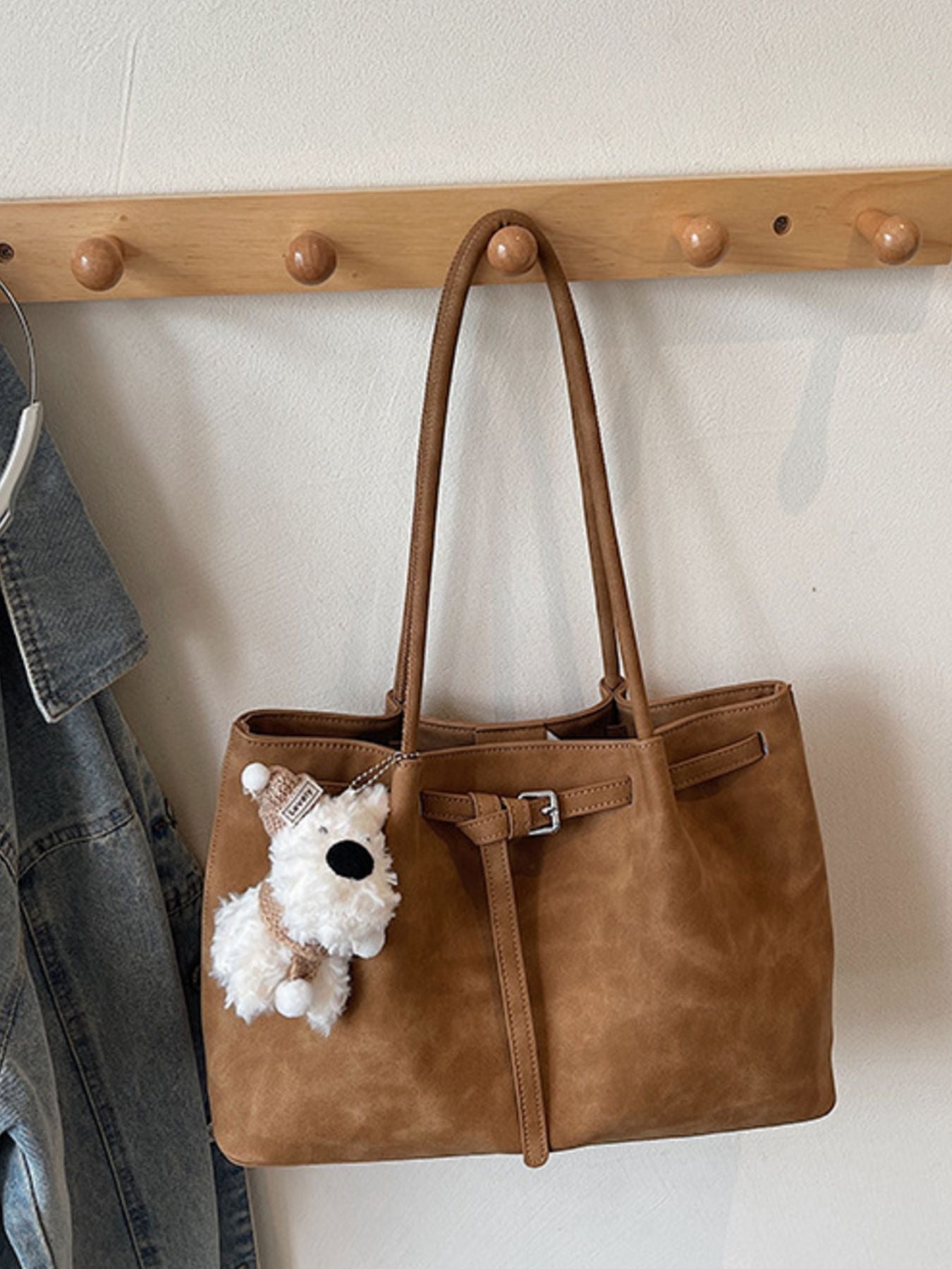 Buckle Detail Shoulder Bag, medium tan PU with buckle strap and teddy bear charm.