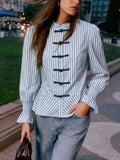 Womens striped mandarin peplum knot shirt in blue and white with black toggle buttons