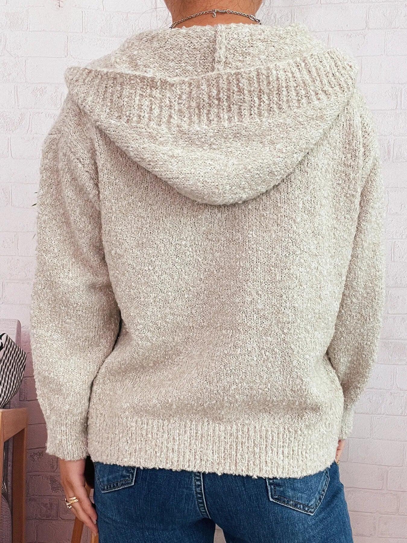 Cozy hooded cardigan back view, cream textured knit hood and long sleeves.