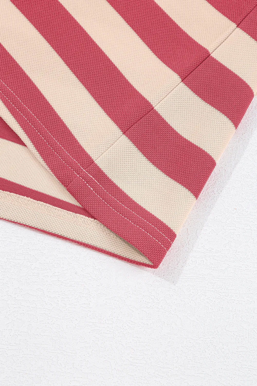 Dusty pink and cream striped fabric cuff with contrast topstitching