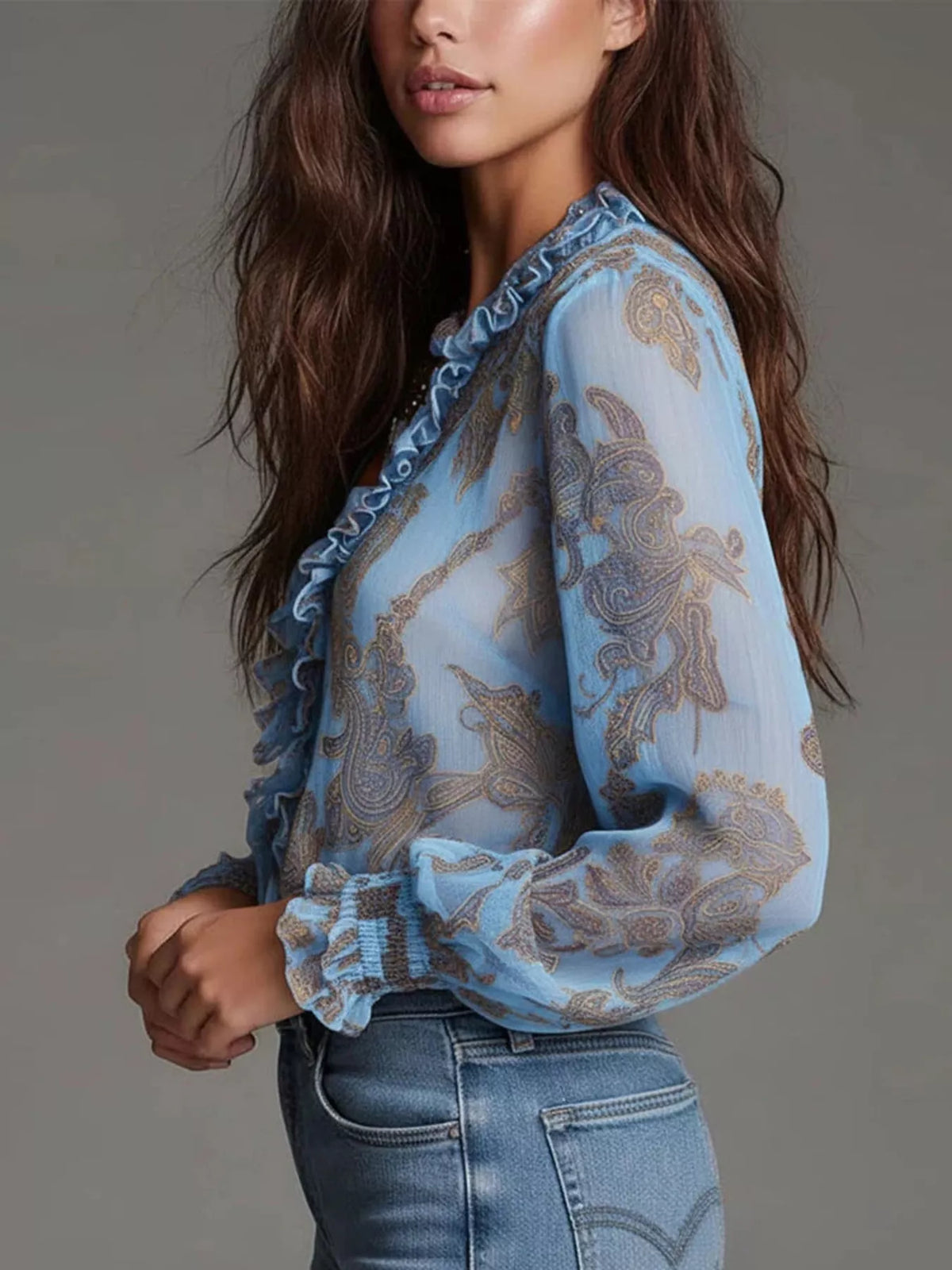 Sky blue paisley ruffle zip-front blouse with long ruffled sleeves and zipper front