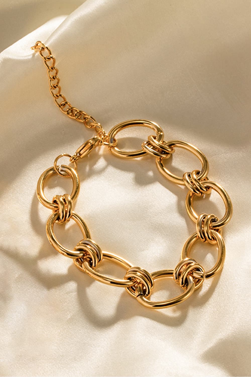 Gold chunky chain bracelet with mixed oval links and large ring clasp