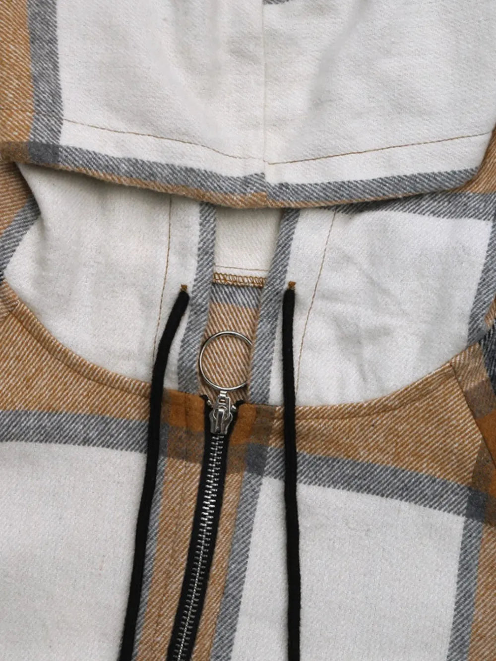 Zip-up camel plaid hood jacket detail: front zipper and hood drawcord