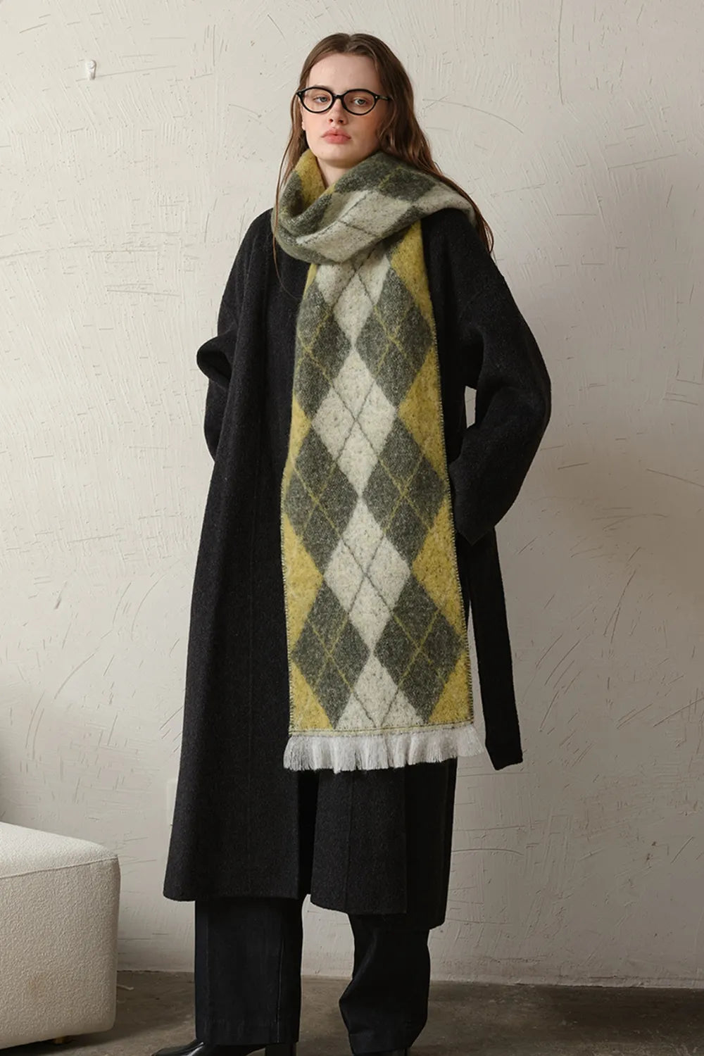 Moss-green argyle polyester scarf with fringed ends, gray and white diamond pattern.