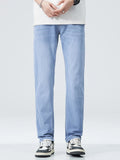 Men’s washed stretch straight-fit jeans in light blue with front button and pockets