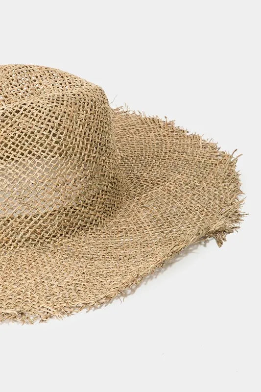 Tan braided straw fedora hat, side view with fringe trim