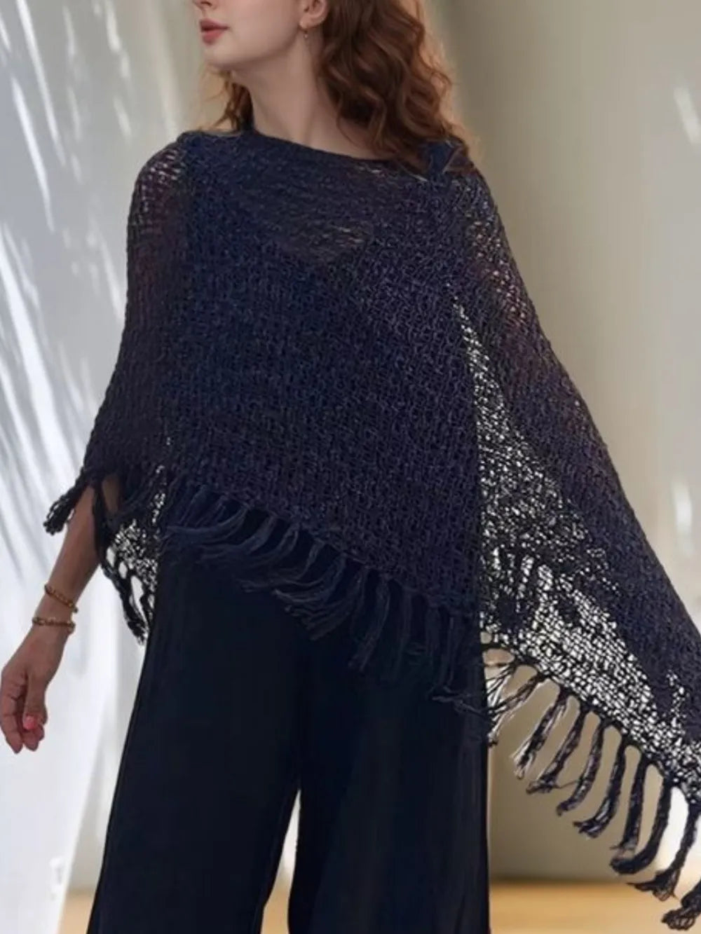 Navy open-knit shawl with boat neck and long fringe trim at sides