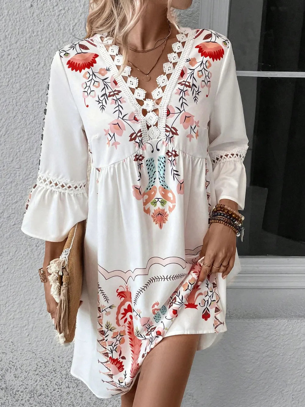 White printed three-quarter sleeve dress with lace-trim V neckline and red floral pattern