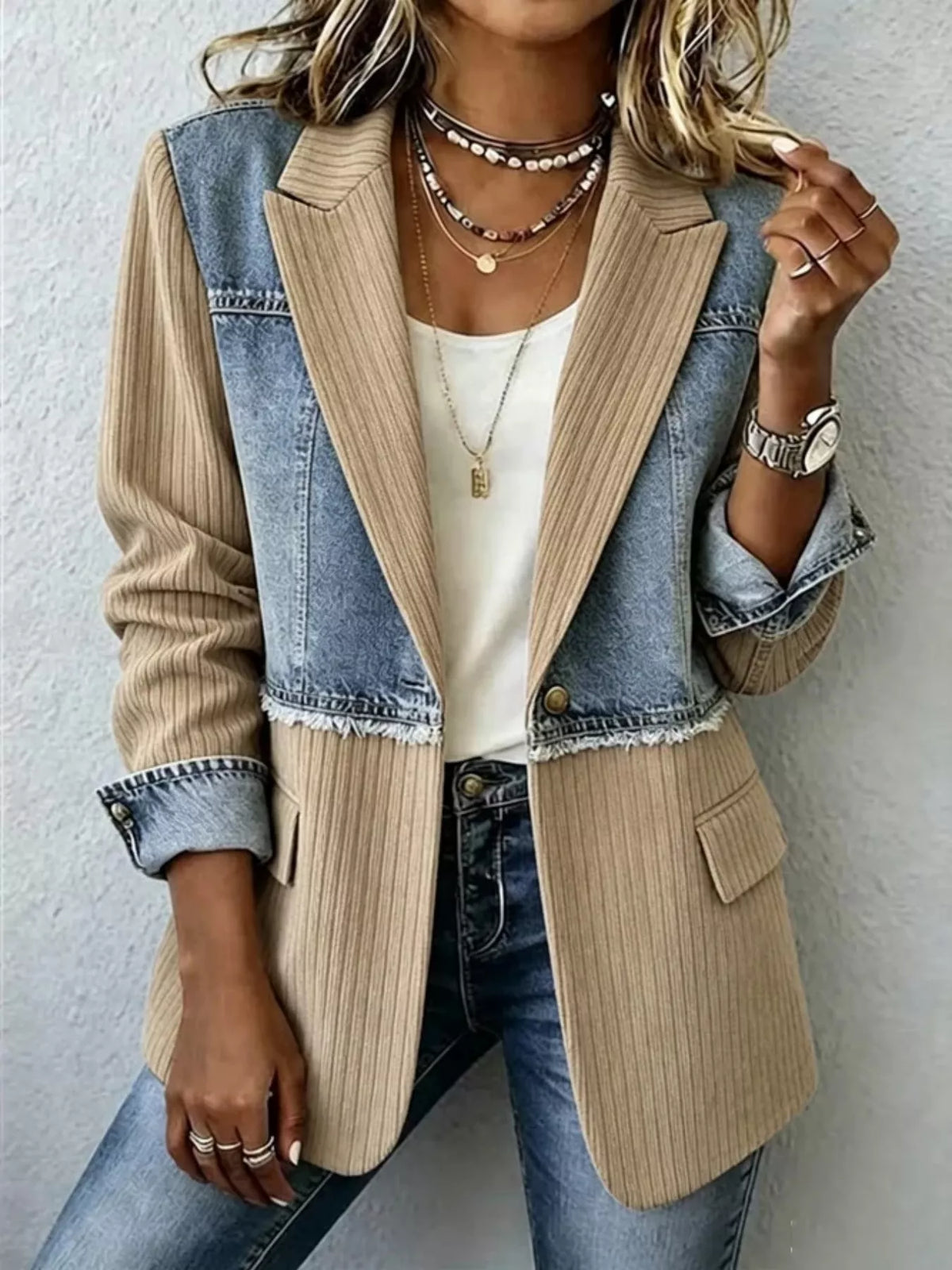 Tan and light blue patchwork denim blazer with ribbed texture and flap pockets.