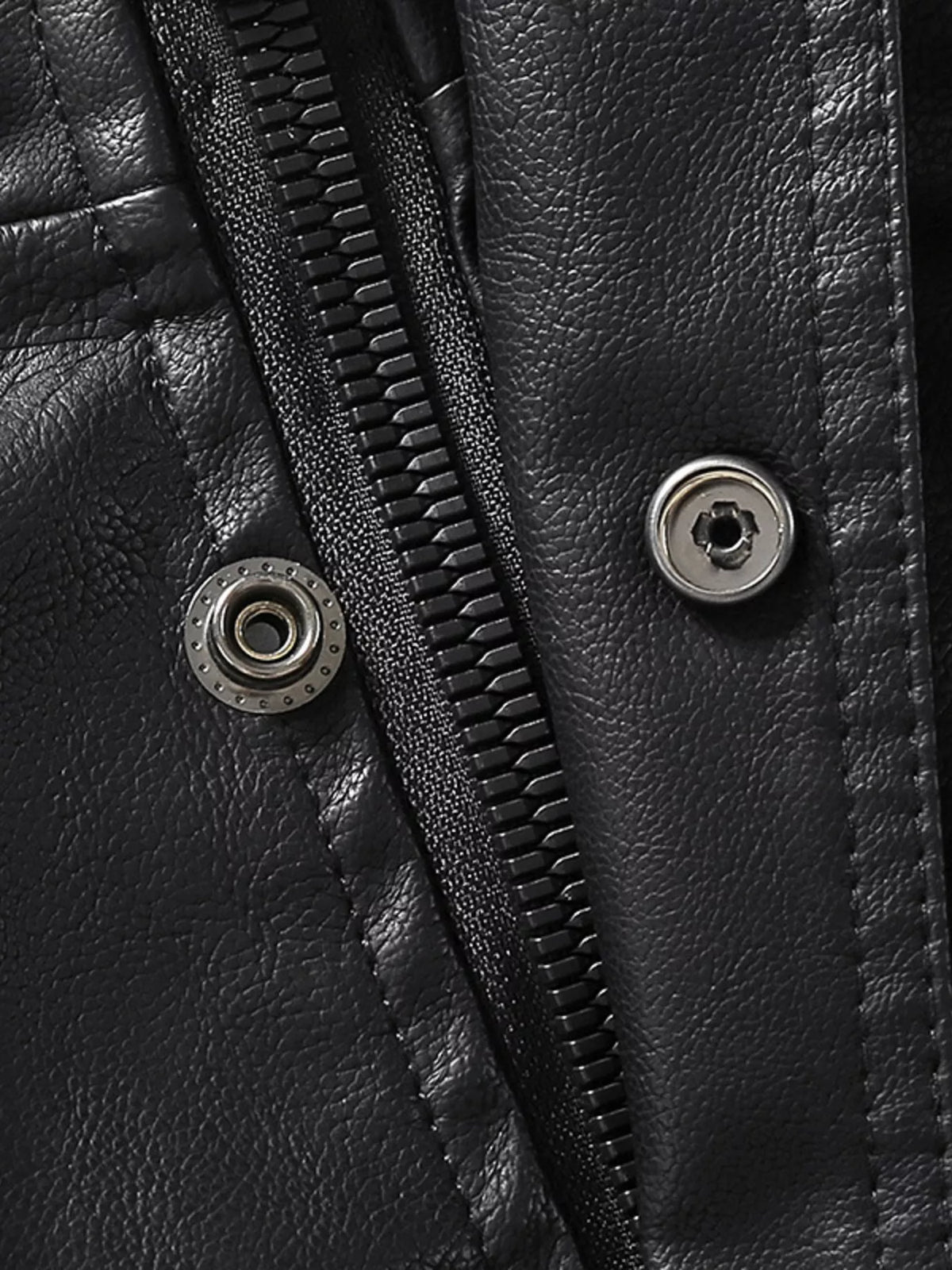 Men’s black vegan leather jacket button and zipper tab close-up detail
