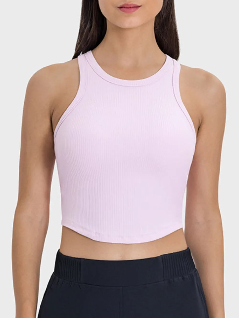 Blush pink ribbed active tank with round neck and racerback straps, cropped hem
