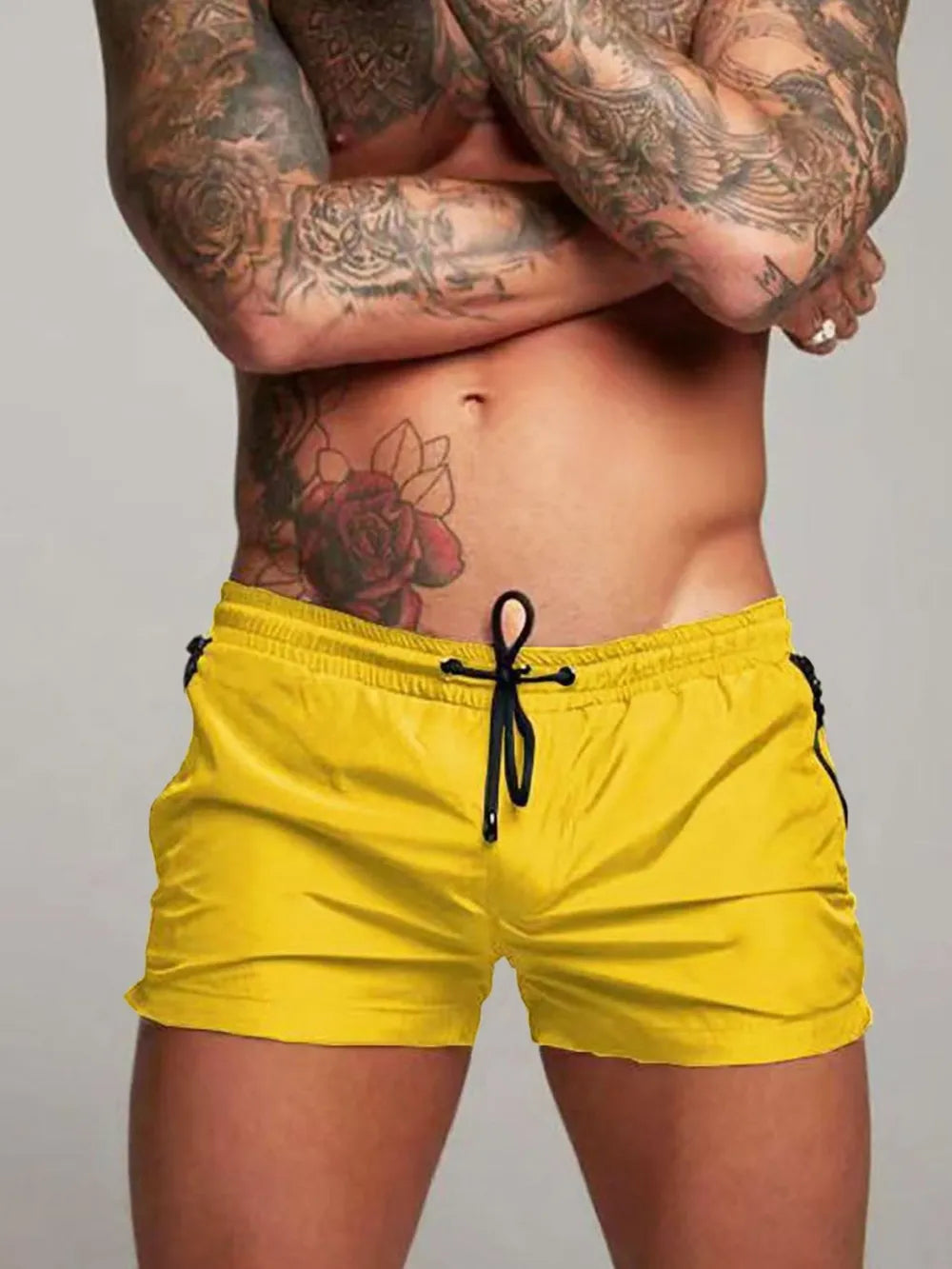Men's active shorts in yellow with drawstring ties and side pockets