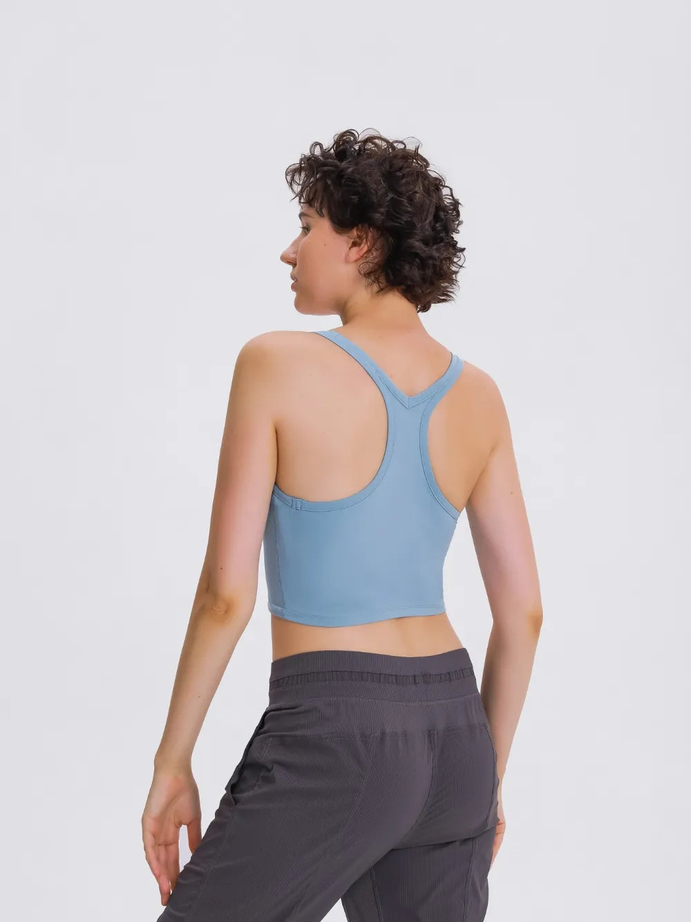 Blue active scoop-neck tank top, back view with racerback straps