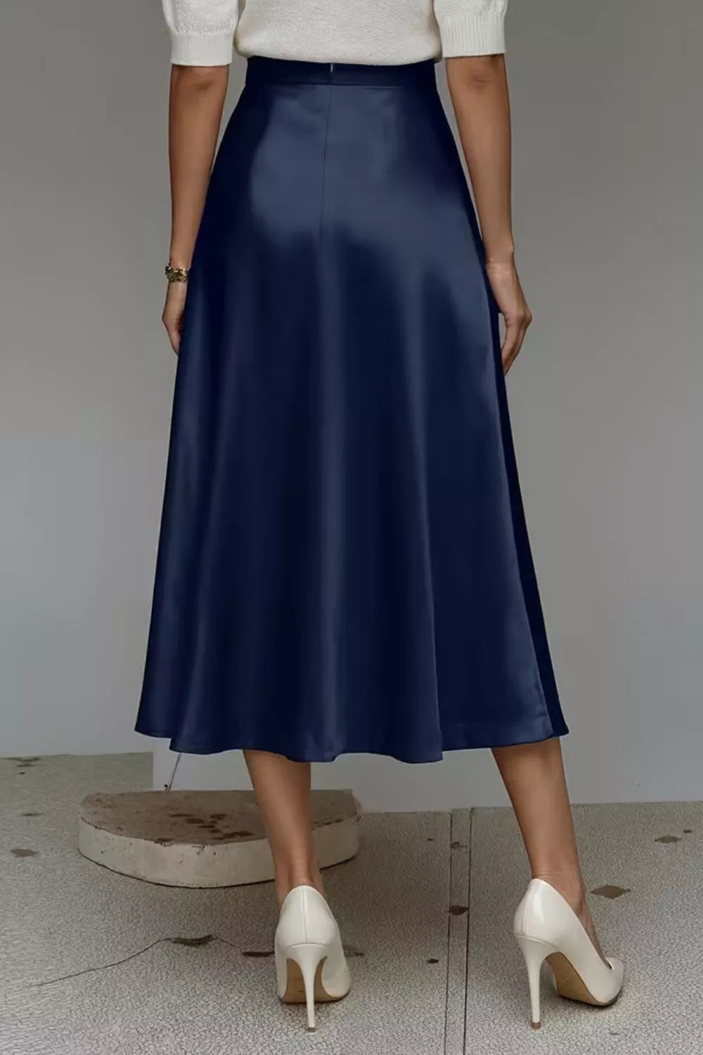 Satin A-line midi skirt in navy with wide pleat-free A-line shape