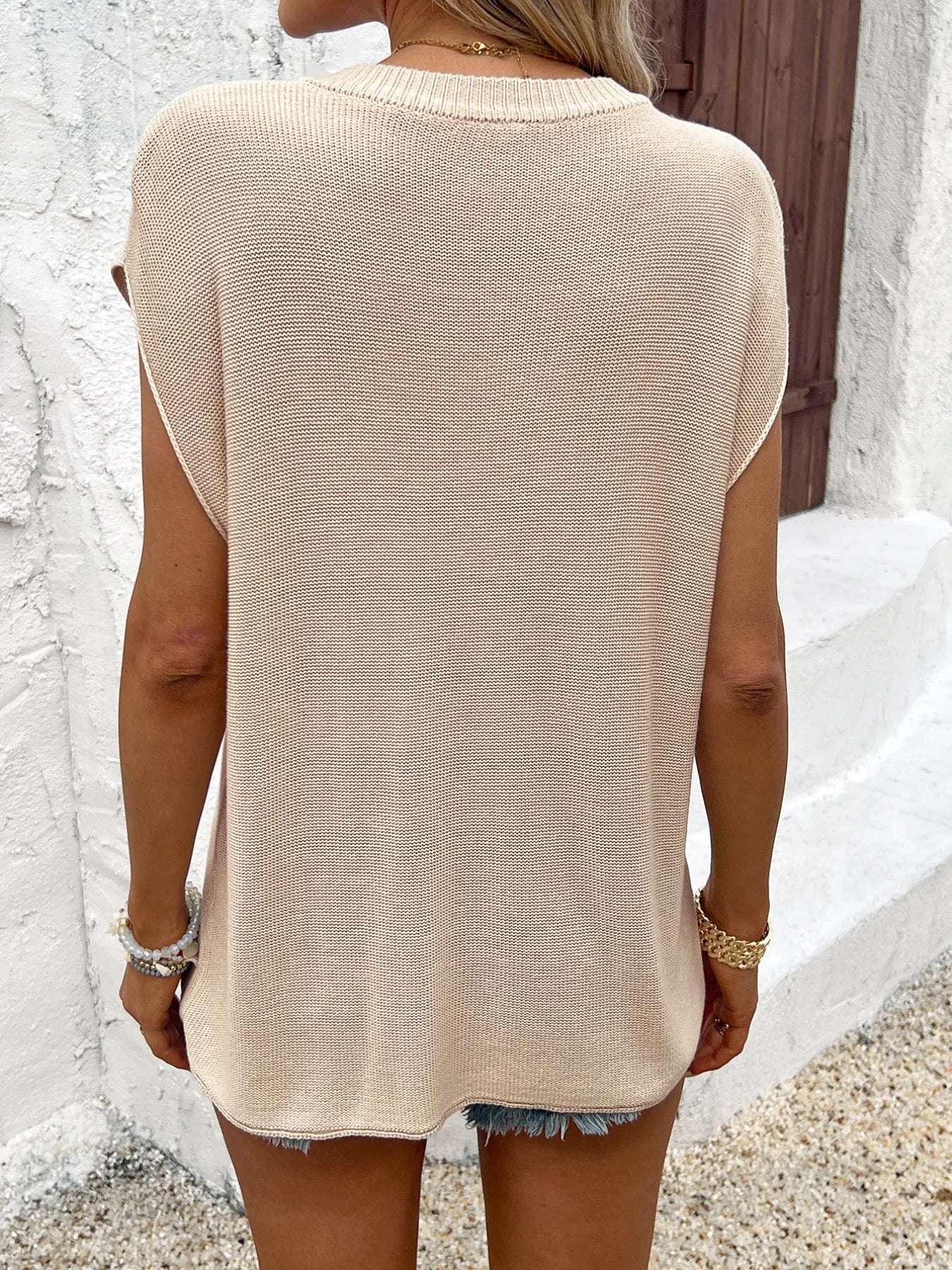 Apricot knit short-sleeve sweater back view with crew neckline and relaxed fit
