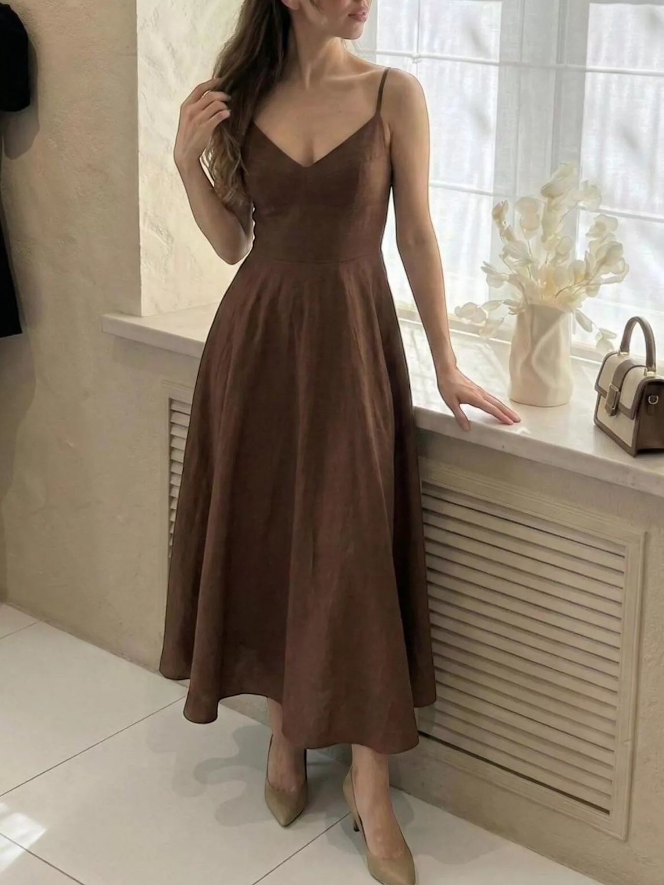 Cedar & Moore brown A-line spaghetti strap midi dress made of polyester with a V-neckline and flowing skirt.