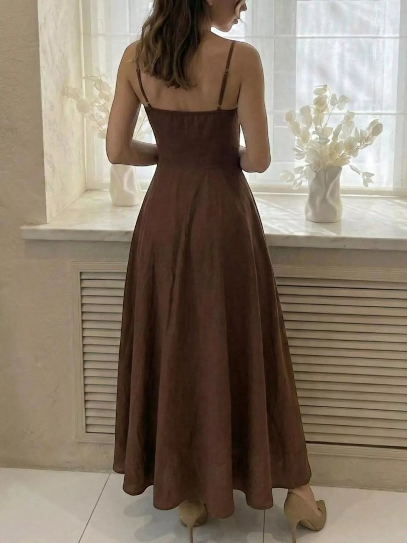 Cedar & Moore A-line spaghetti strap midi dress in brown polyester. Features adjustable straps and a flowing skirt.
