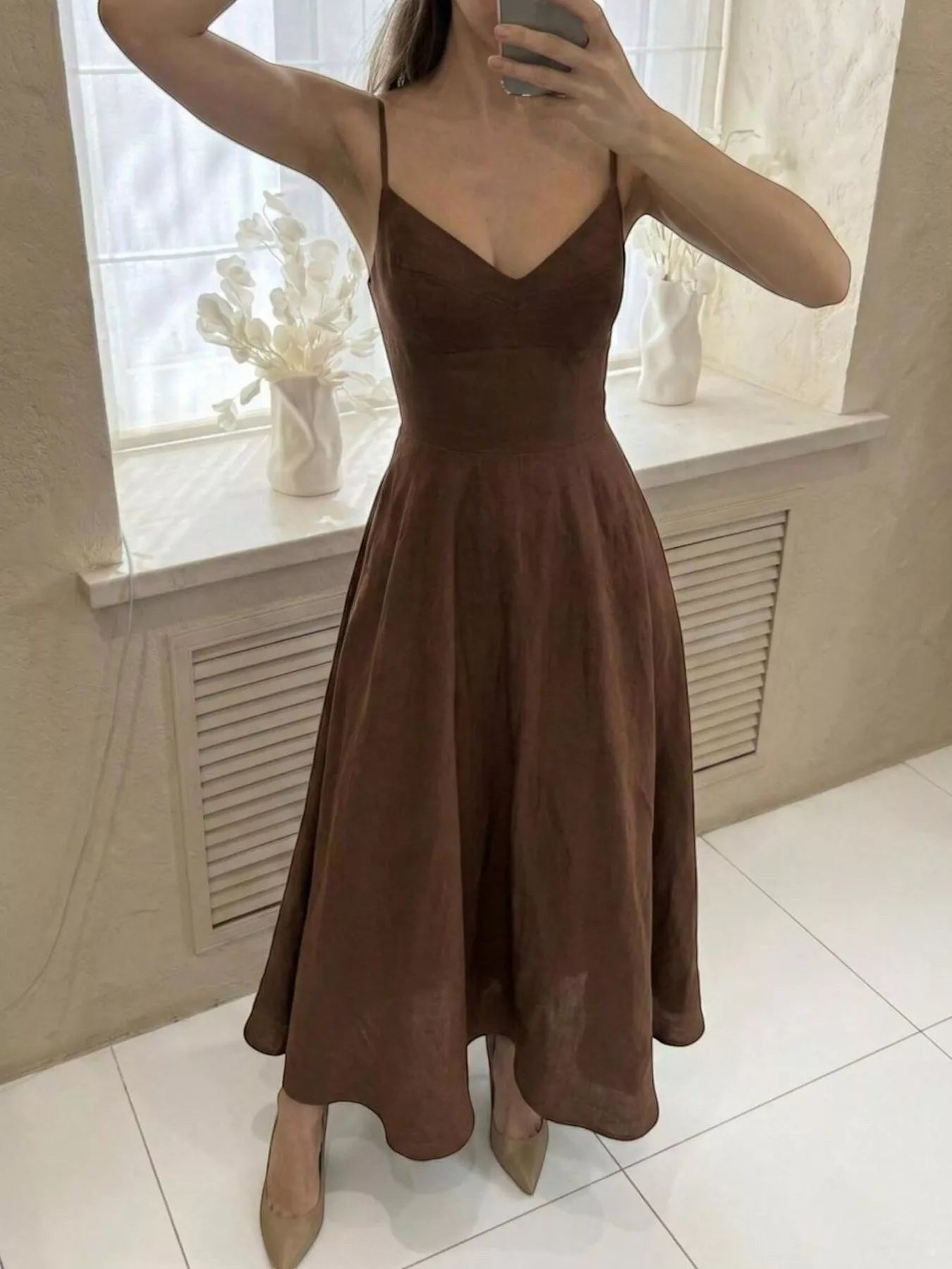 Cedar & Moore brown A-line spaghetti strap midi dress with a flattering V-neck and flowing skirt.
