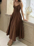 Cedar & Moore A-line spaghetti strap midi dress in brown polyester. Flattering V-neck and flowing skirt.