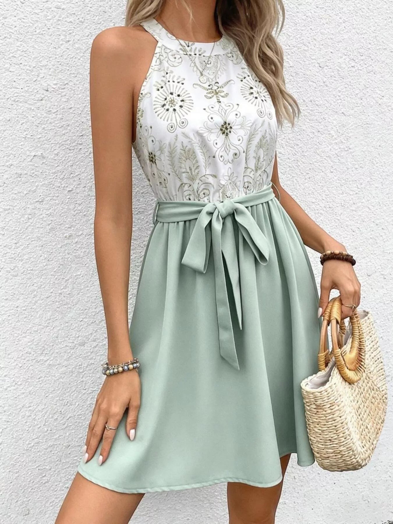 Cedar & Moore sleeveless A-line dress in sage green with white patterned bodice and tie waist.