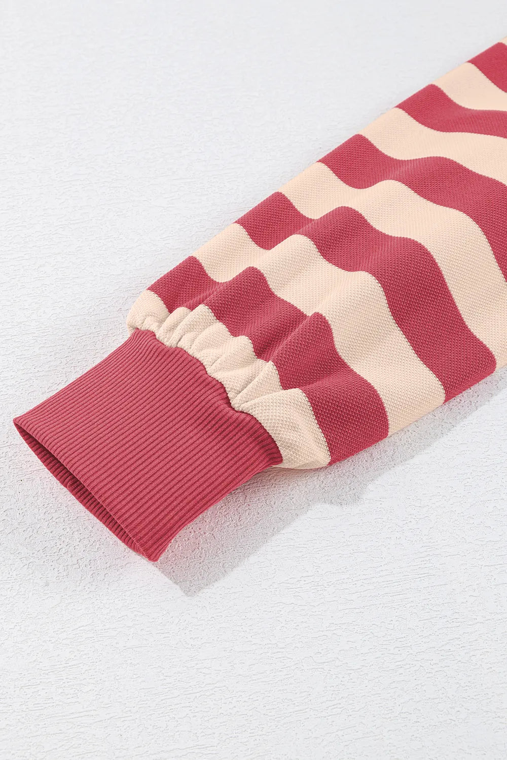 Dusty pink and cream striped sleeve with elastic cuff and contrast hem detail