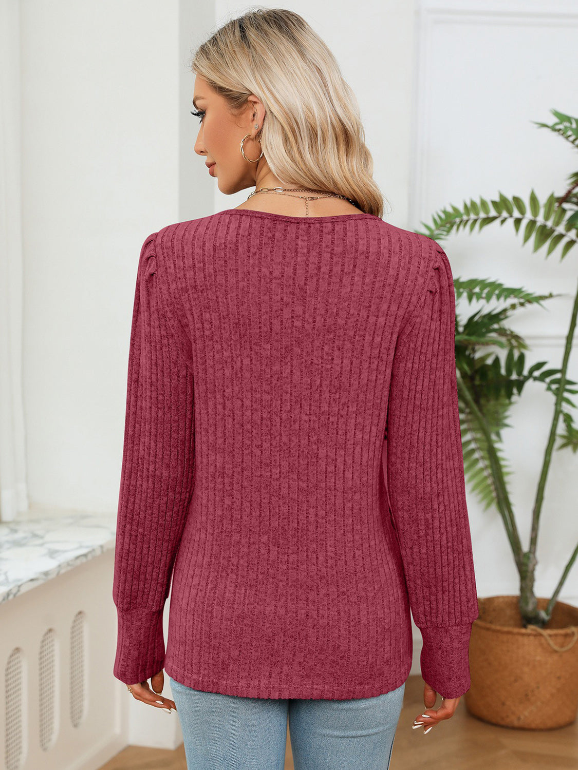 Brick red ribbed knit blouse, back view with long sleeves and crew neckline
