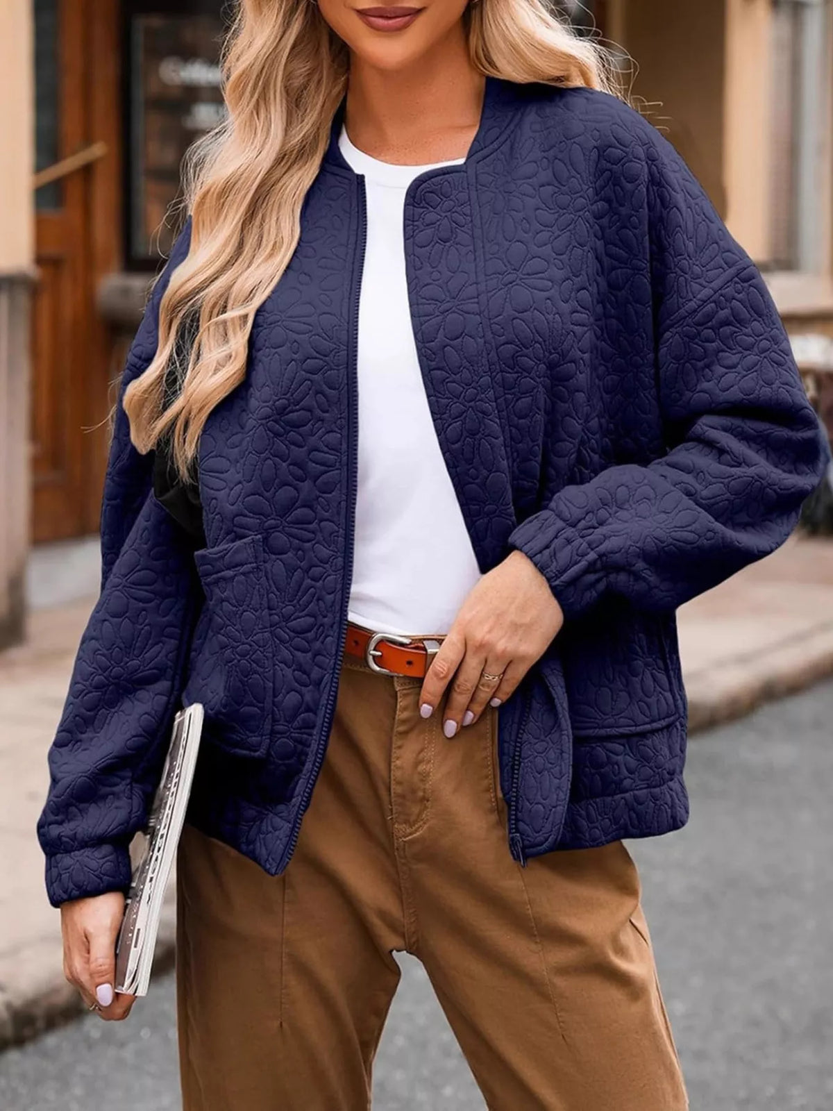 Quilted zip-up jacket with pockets, navy blue floral-texture front