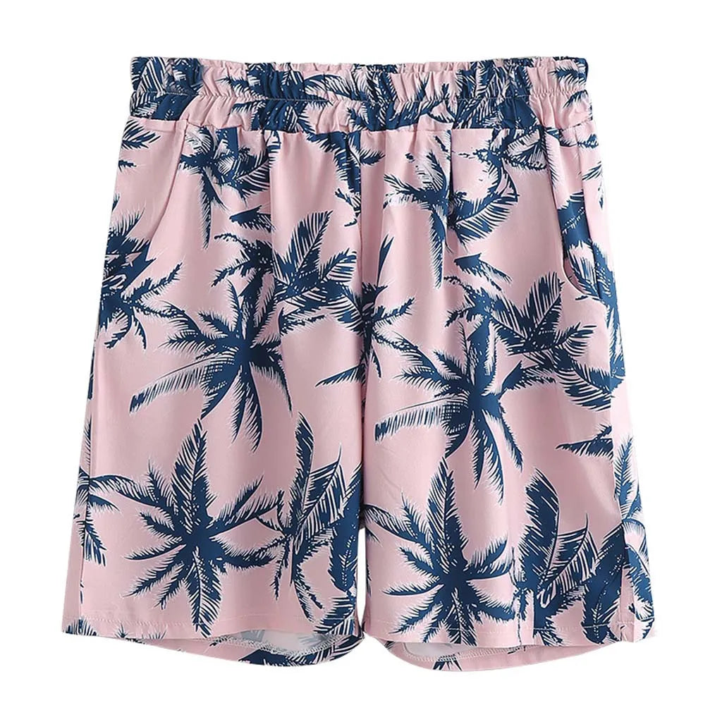 Pink tropical print shorts with elastic waistband