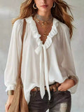 White ruffle V-neck front-tie blouse top with long sleeves and gathered trim