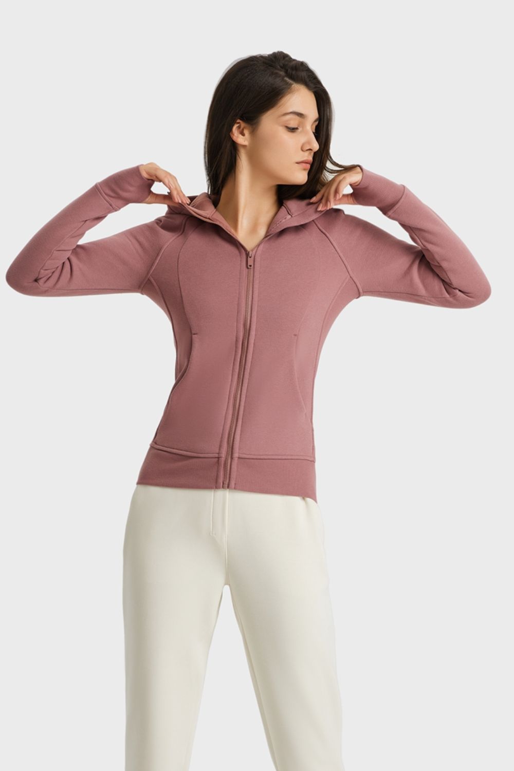 Dusty pink zip-up hooded sports jacket with seam detail and long sleeves