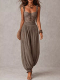 Dark gray lace corset jumpsuit with ruffled neckline and gathered harem pant legs