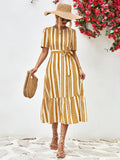 Gold striped round-neck puff sleeve dress with tied waist belt, tiered skirt.