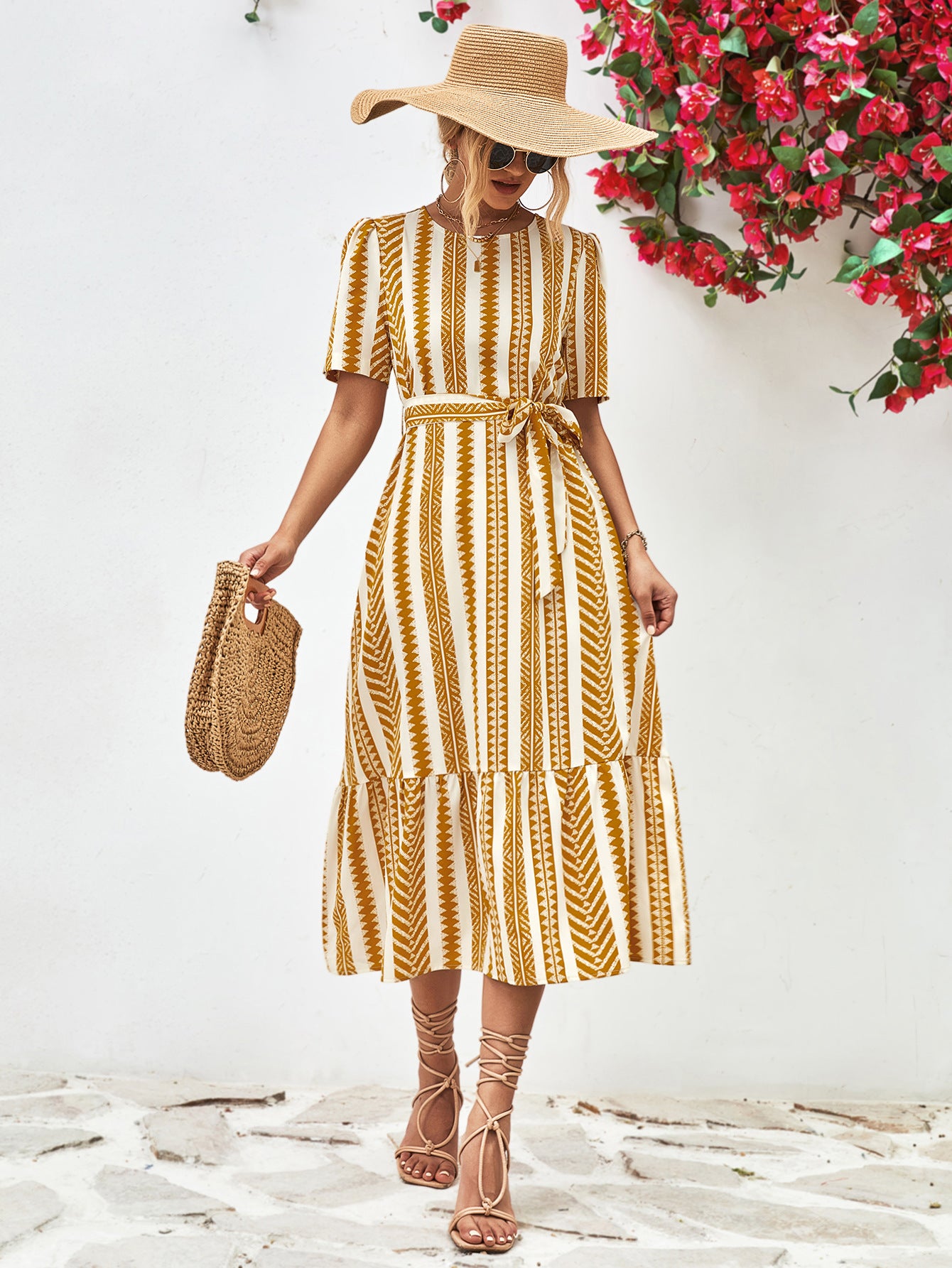 Gold striped round-neck puff sleeve dress with tied waist belt, tiered skirt.
