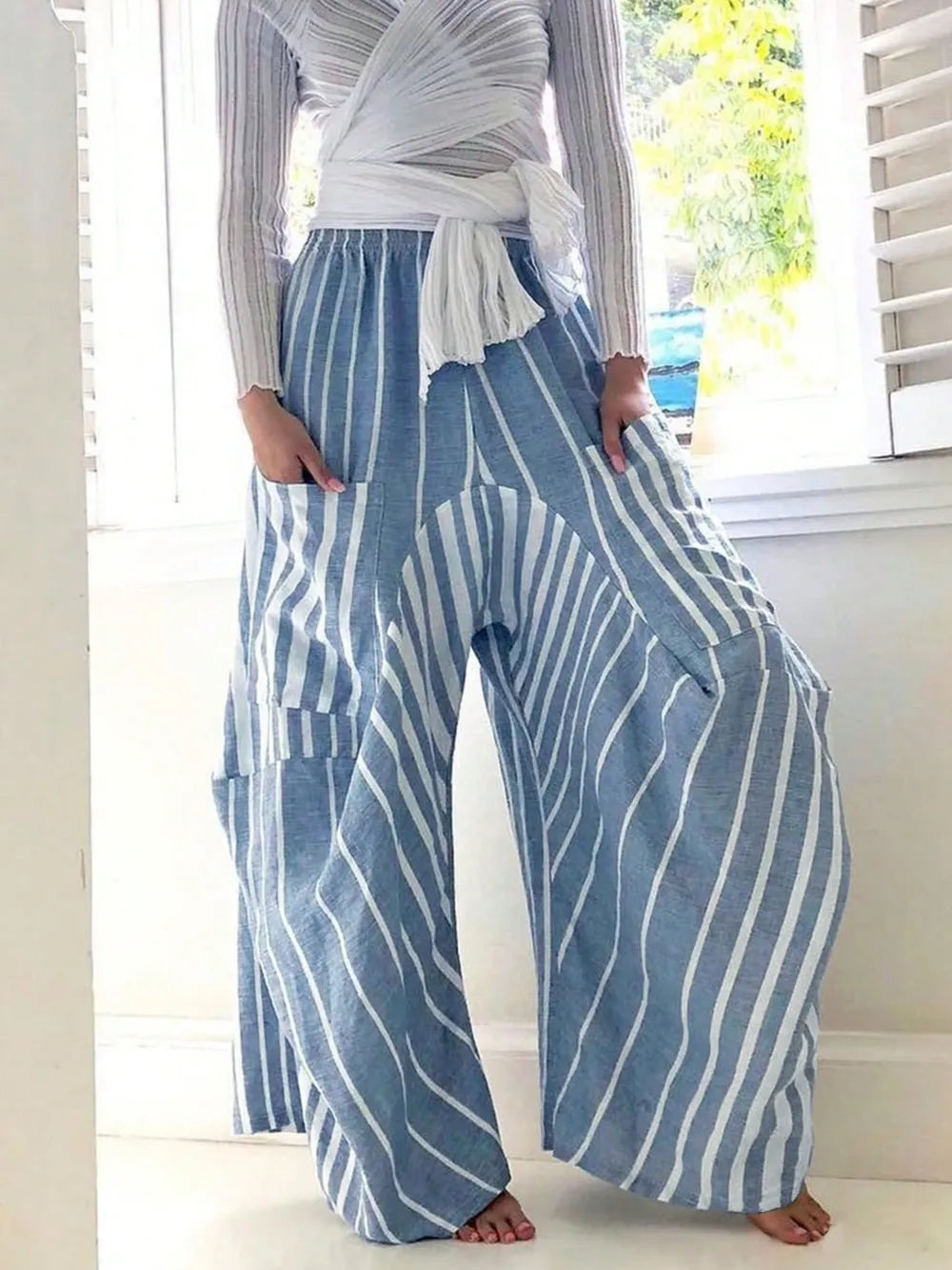 Light blue striped wide-leg pants with elastic waist, full-length