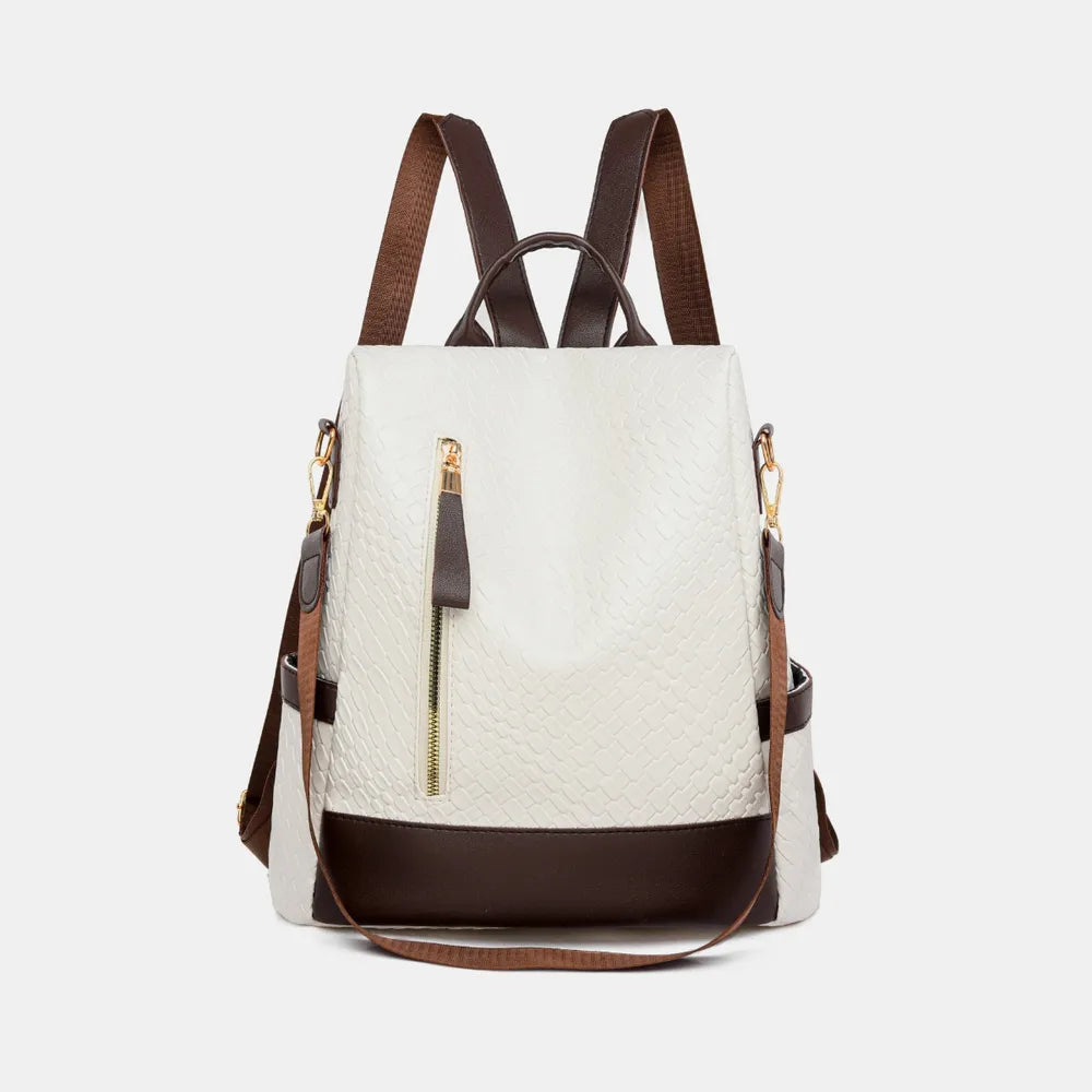 Vegan leather backpack bag in ivory with dark bottom trim and front zipper pocket.